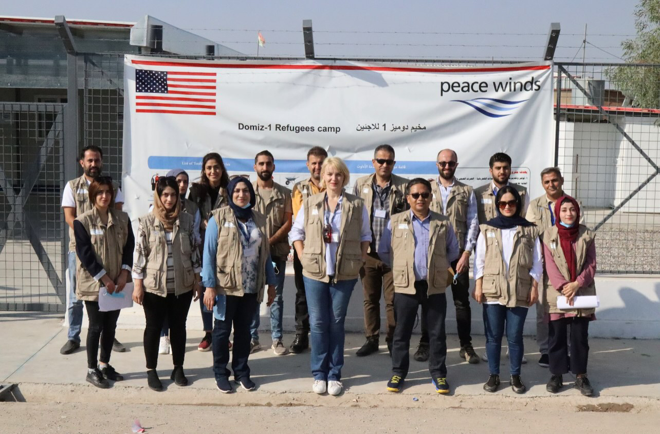 group of Peace Winds staff pose in Erbil, Iraq