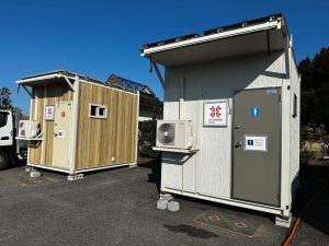 outside view of two large portable restrooms